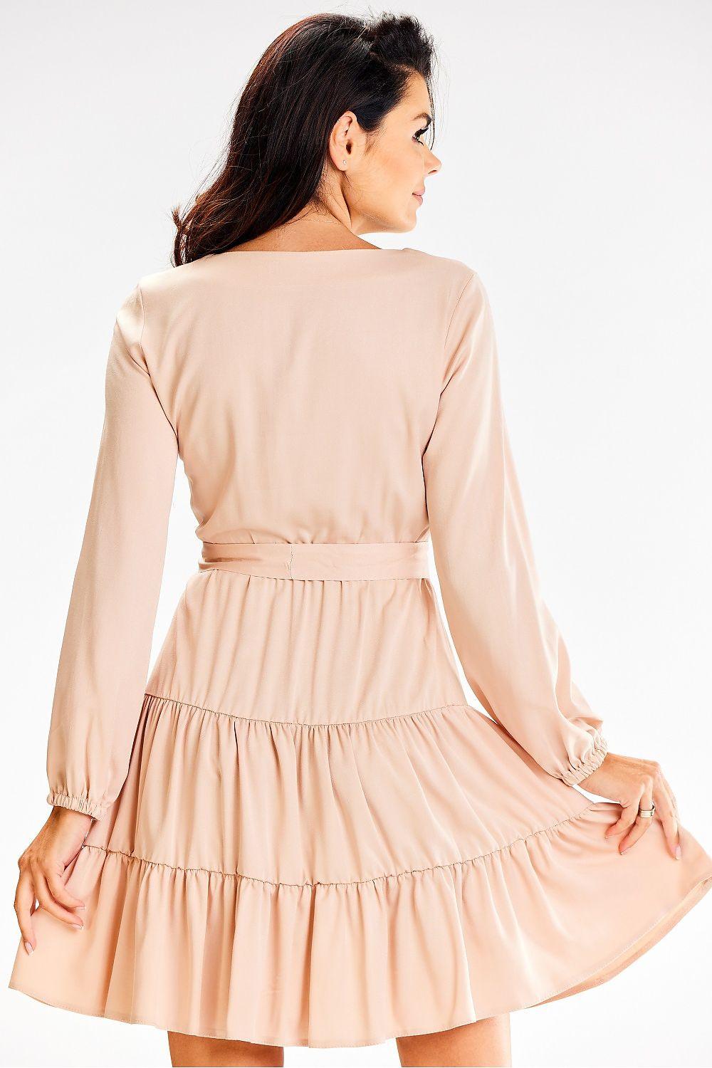Beige long-sleeve daydress with tiered skirt and belted waist