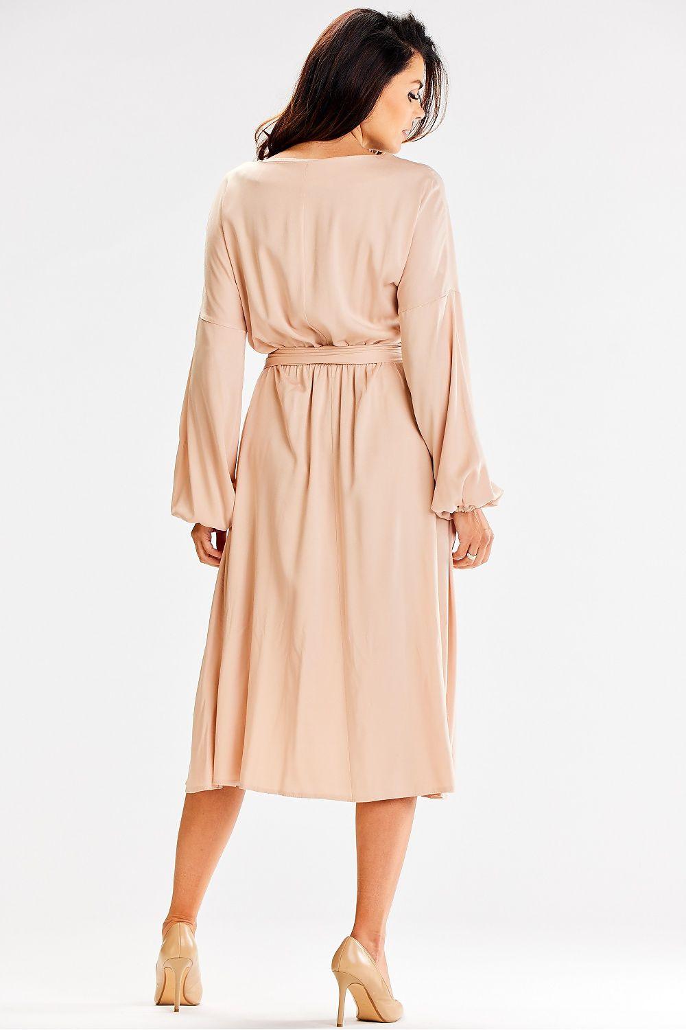 Beige daydress by awama, back view, long sleeves, tied waist, midi skirt
