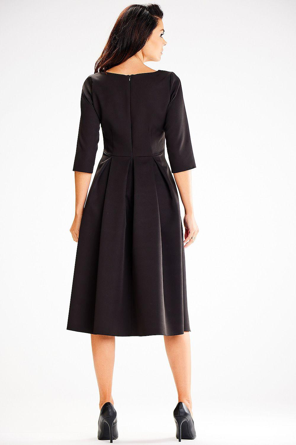 Black V-neck day dress back view with waist seam and pleated A-line skirt