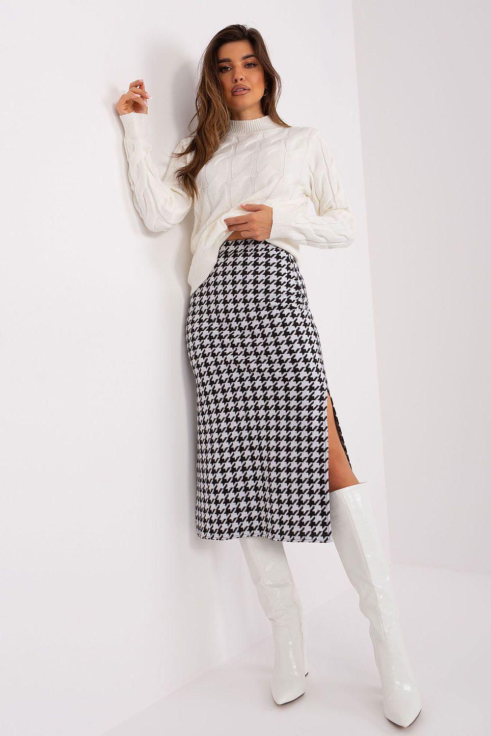 High-waist houndstooth knit midi skirt with peplum overlay and front slit