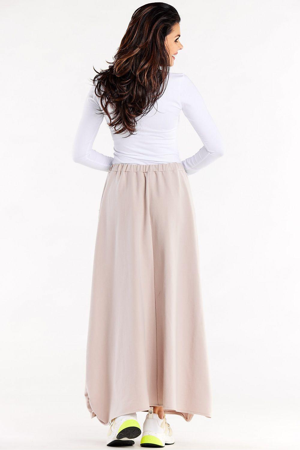 Beige long trapeze skirt with elastic waist and gathered back pleats