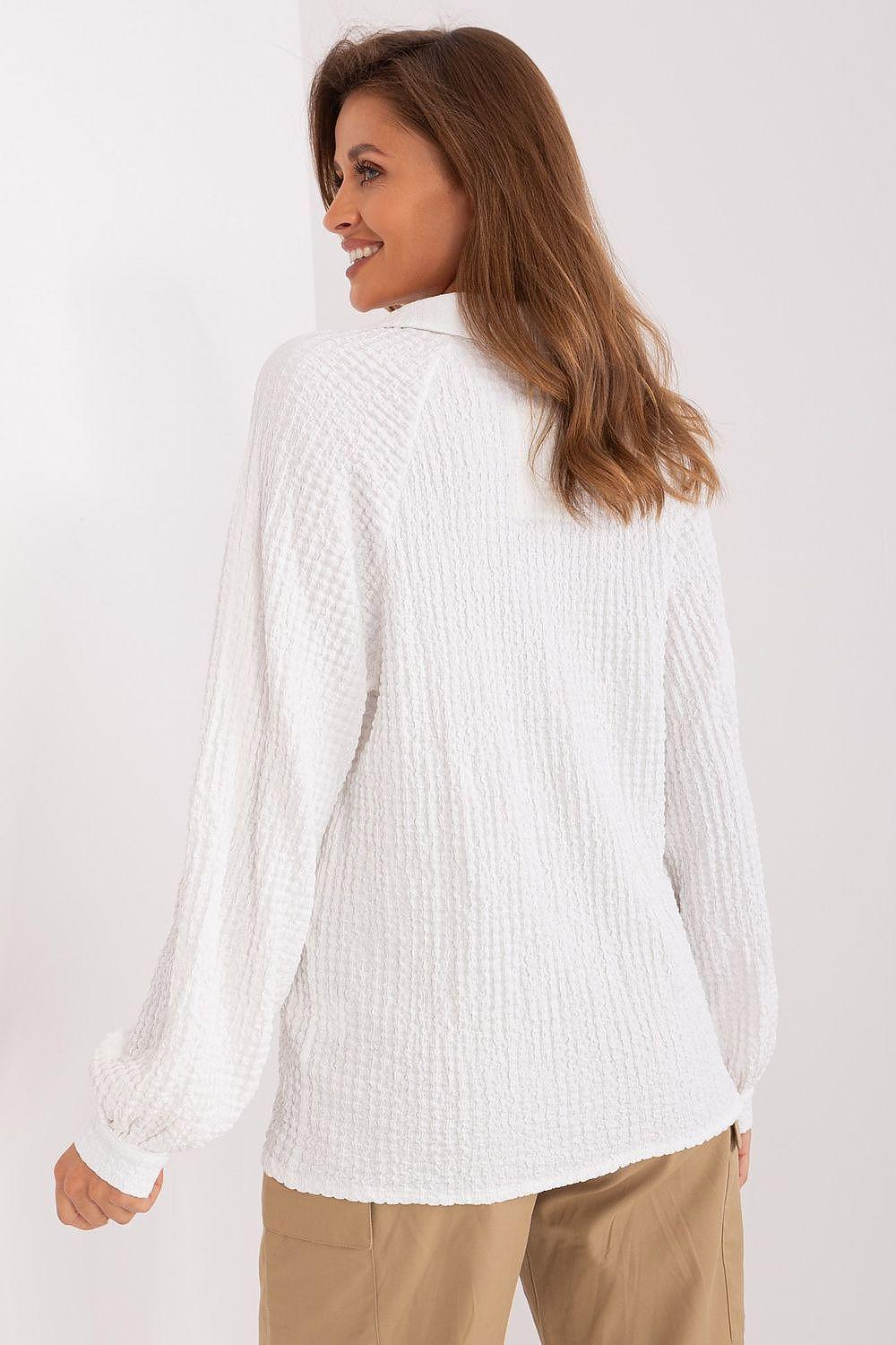 White textured blouse back view with long sleeves and cuffed cuffs