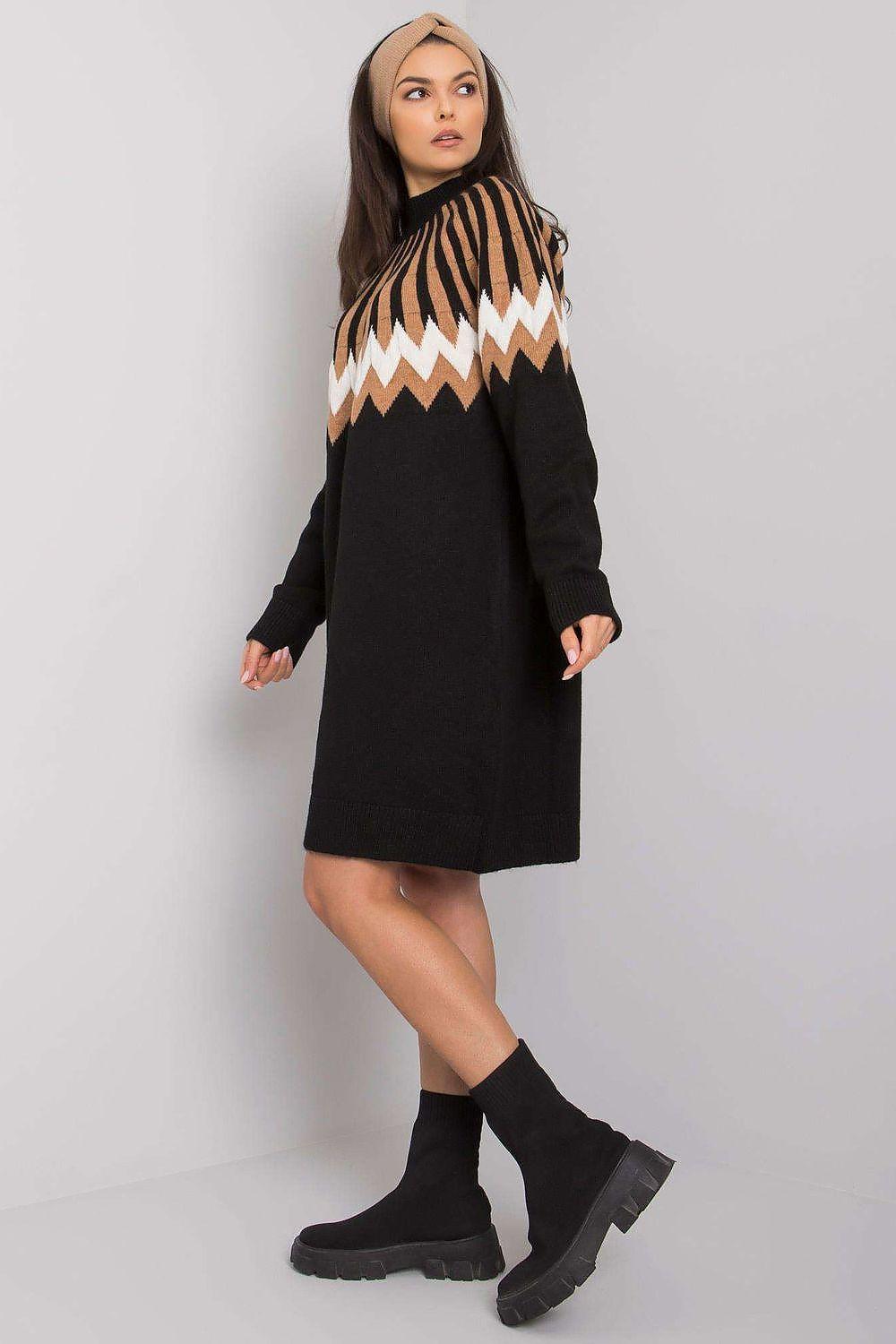 Black daydress with long sleeves and patterned chevron yoke at the chest
