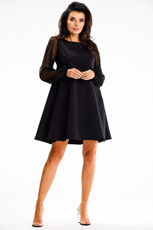 Black A-line evening dress with sheer mesh sleeves, knee-length flared skirt