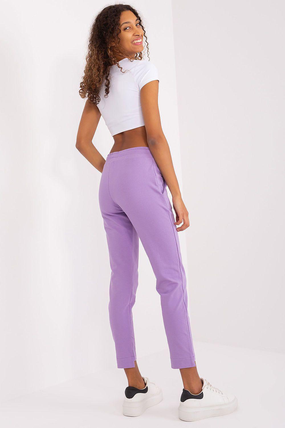 Violet cotton jogger trousers with drawstring waist and embroidered side logo, relaxed straight fit.