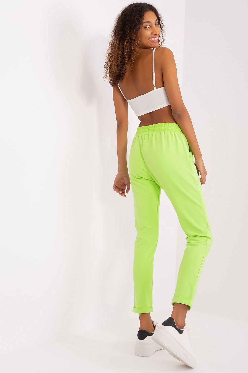 Neon lime tracksuit trousers with elastic drawstring waistband and tapered leg