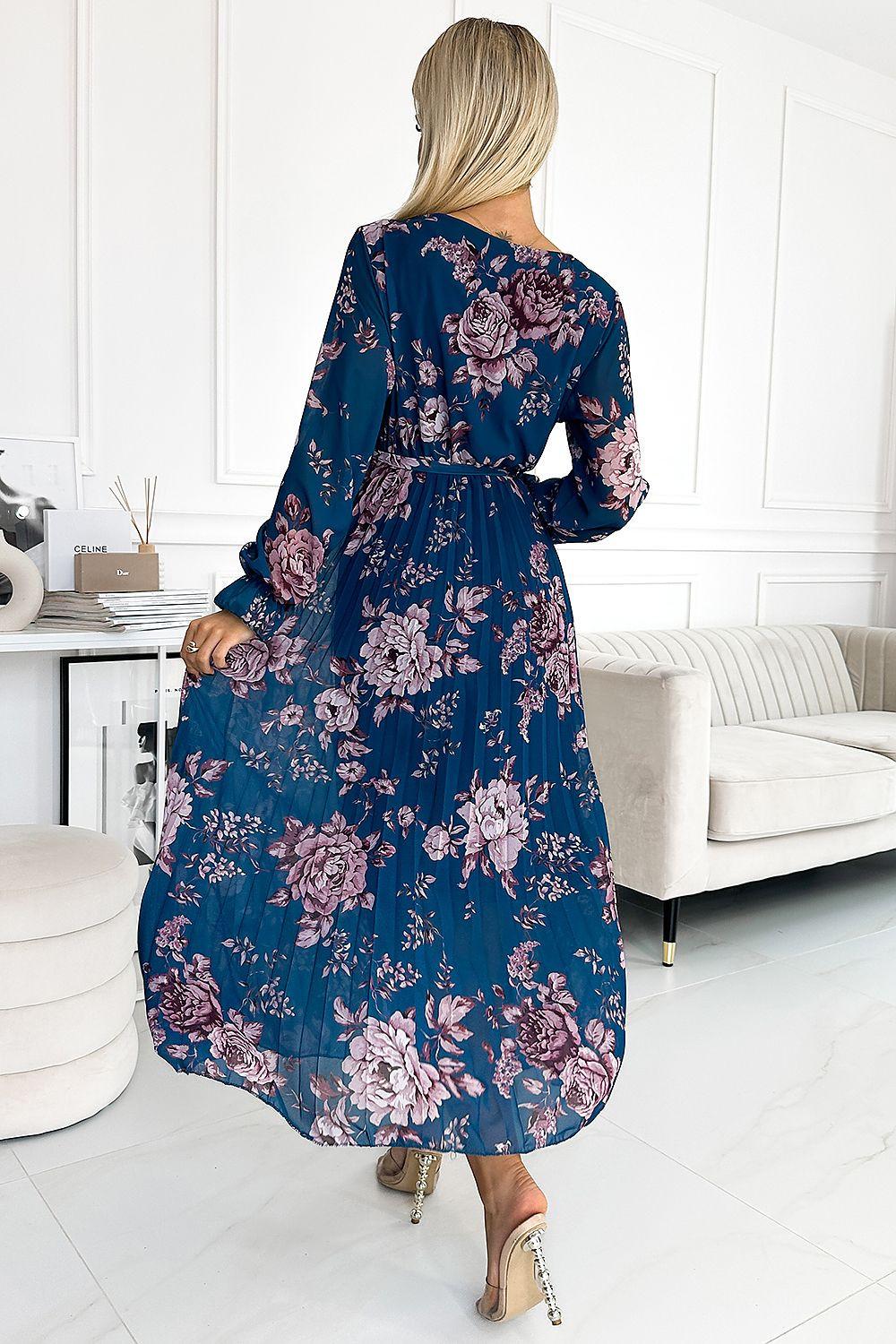 Blue floral cocktail dress with long sleeves and belted waist, back view