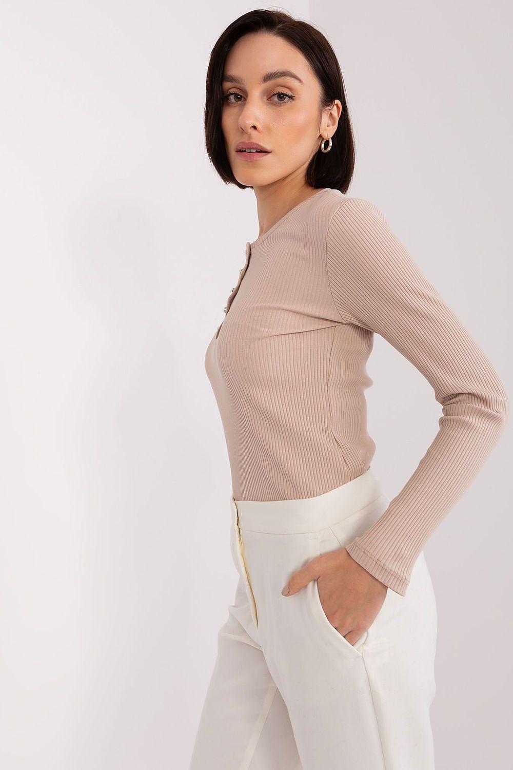 Beige long-sleeve ribbed blouse with button henley placket, side profile