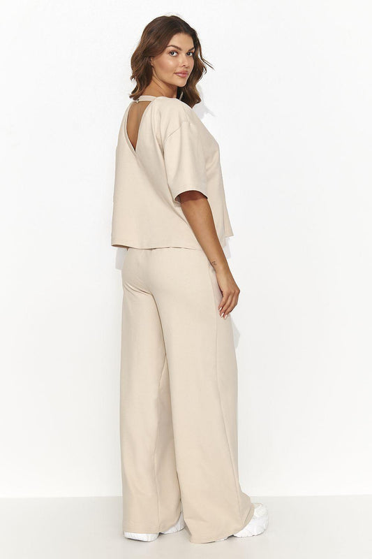 Beige two-piece lounge set with short-sleeve top and wide-leg pants