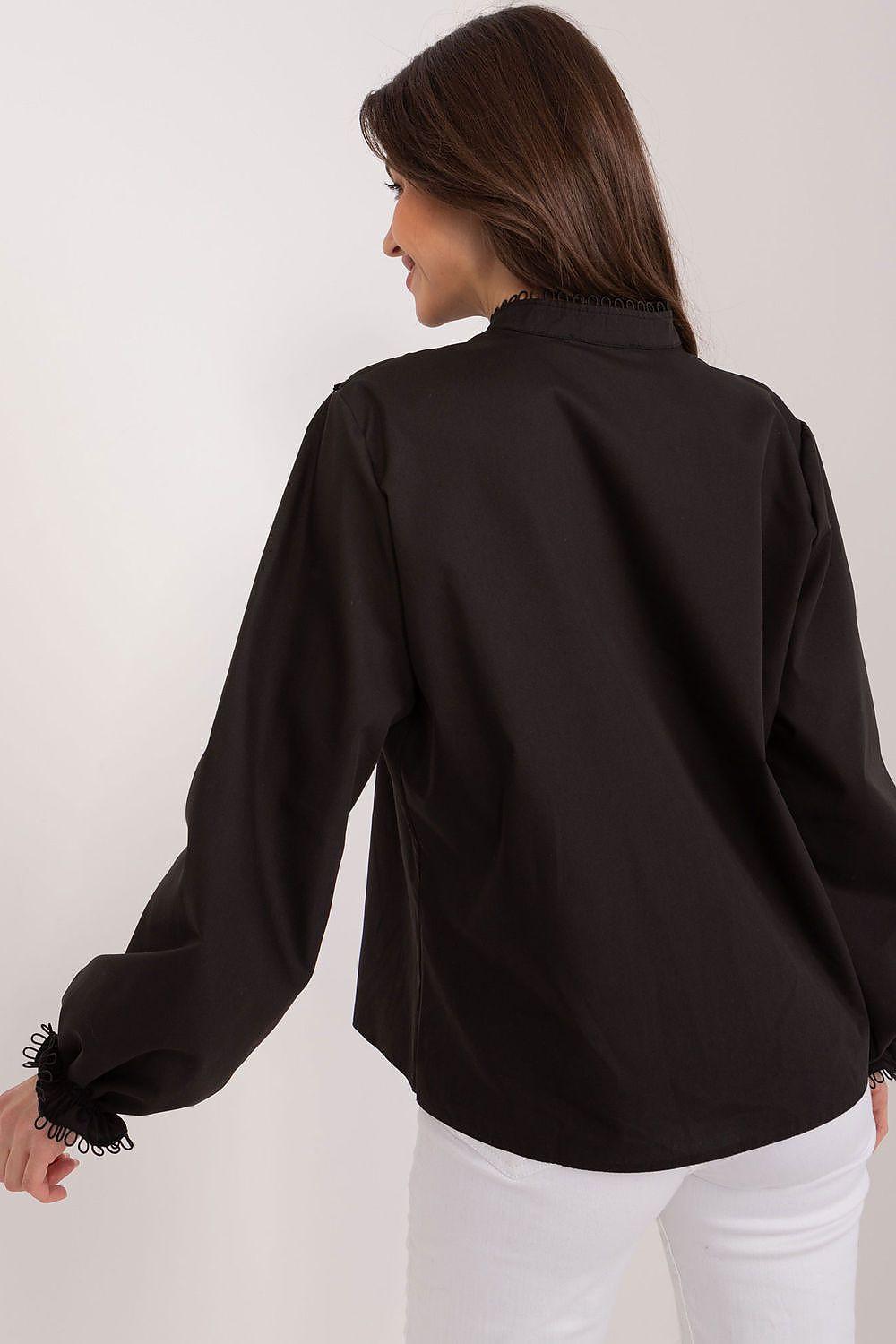 Black Lakerta blouse back view with long sleeves and ruffled neckline