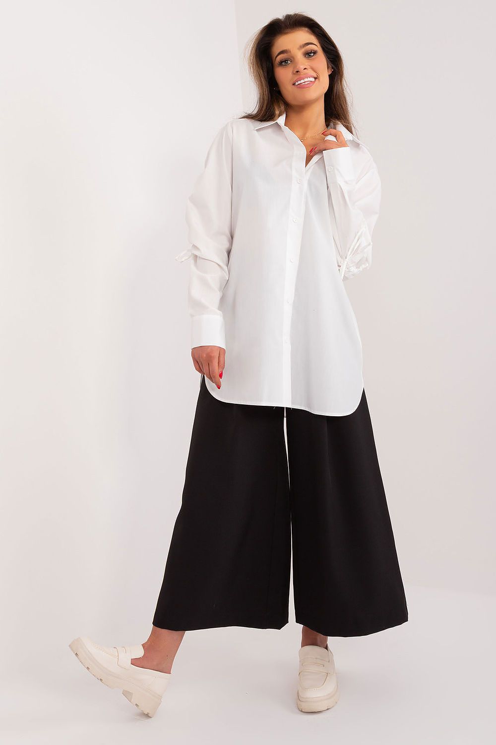 White long sleeve shirt with decorative ribbed cuffs, button front