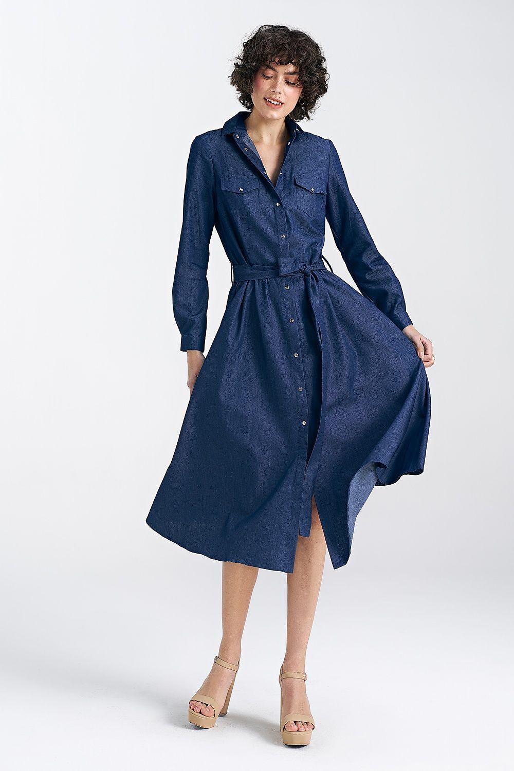 Navy blue button-front daydress with collar and waist tie, long sleeves, flared midi skirt.