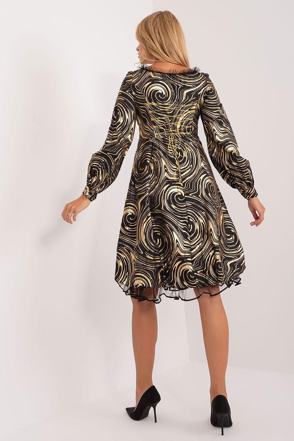 Black-and-gold swirl print evening dress with long sleeves, back view and flared skirt