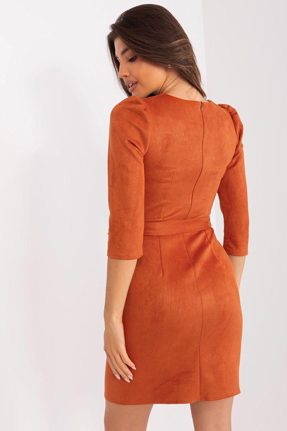 Orange daydress back view with 3/4 sleeves and center back seam