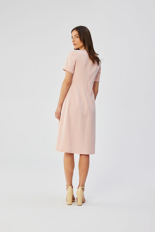 Light pink cocktail dress with short sleeves and pleated skirt, side view