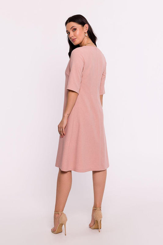 Pink daydress with V-backless neckline? and short sleeves, A-line above-knee length.