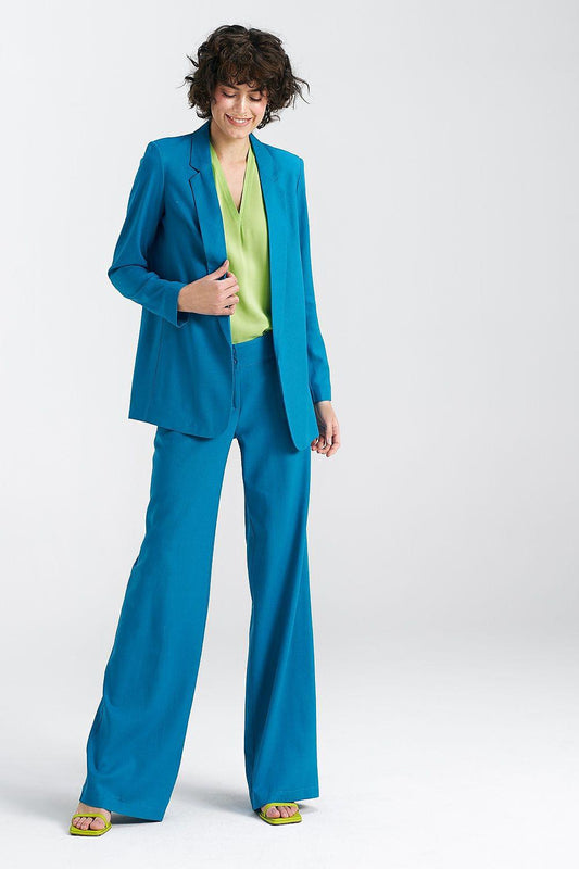 Women's blue loose-fit blazer with notched lapels, worn open with long sleeves