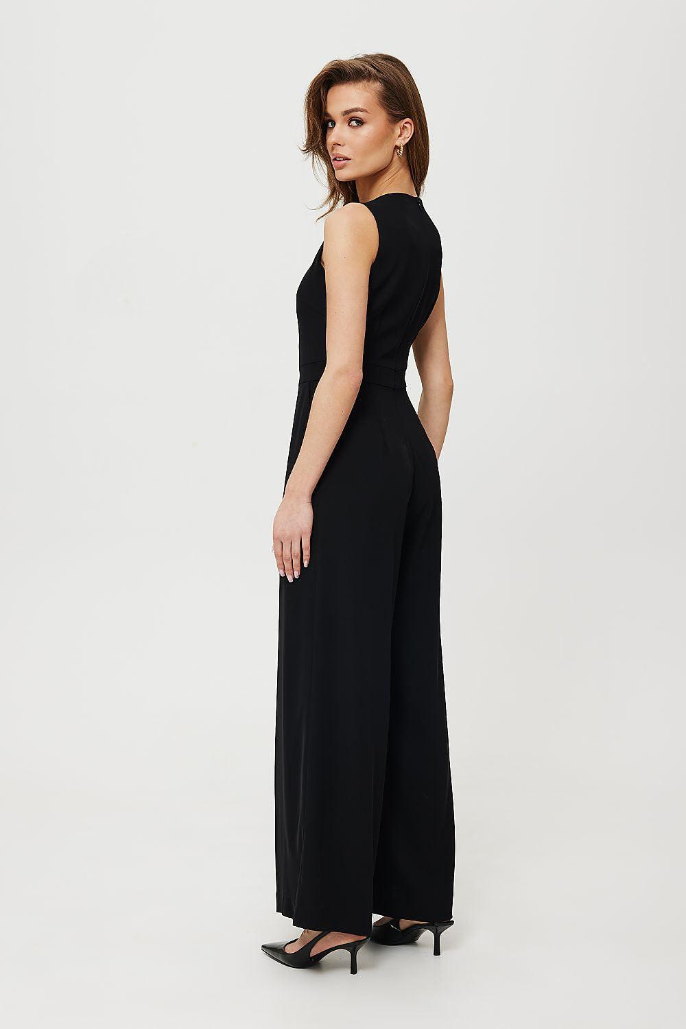 Black sleeveless wide-leg jumpsuit, side view, fitted waist and long wide pant legs