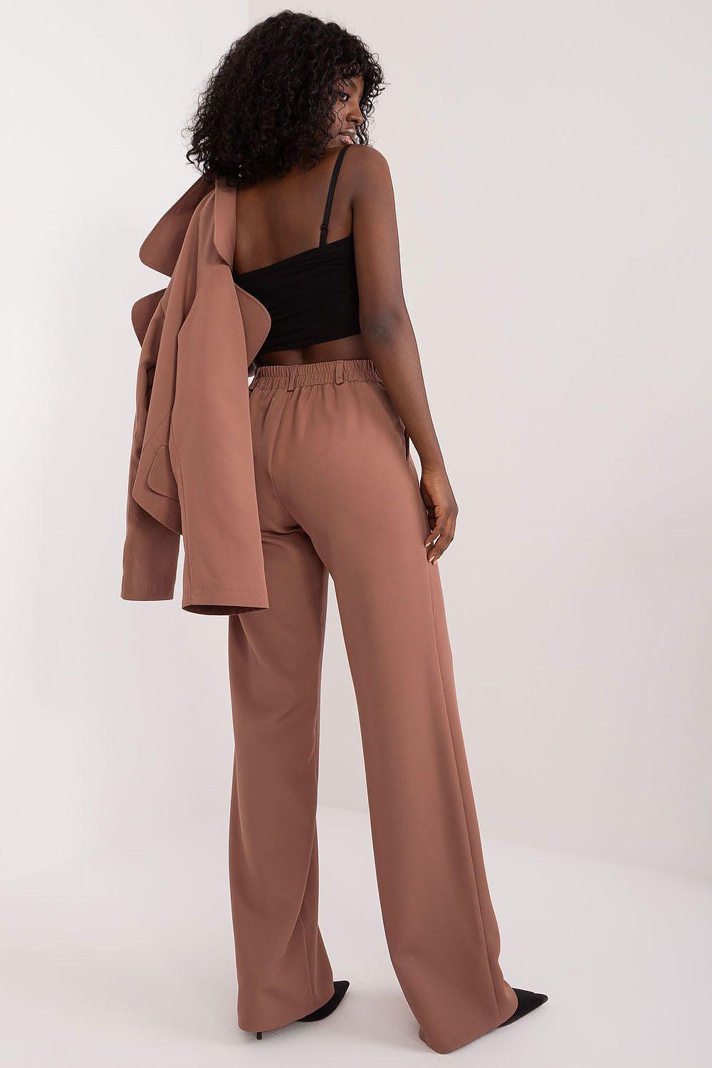 High-rise brown trousers with long straight legs and belt loops