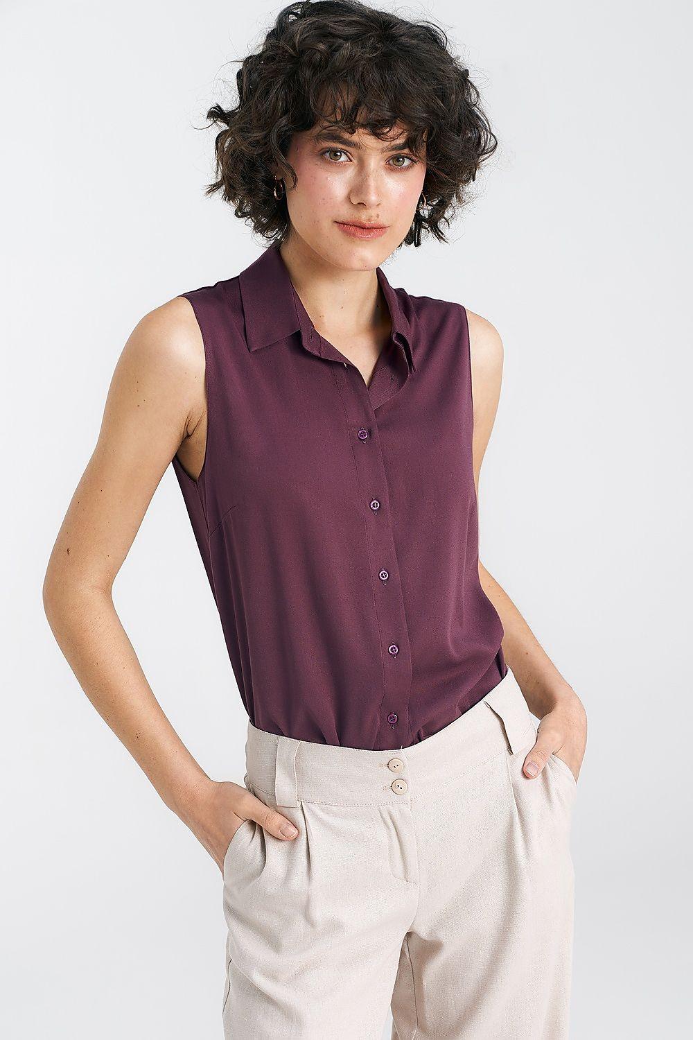 Violet sleeveless button-up shirt with pointed collar and front buttons.