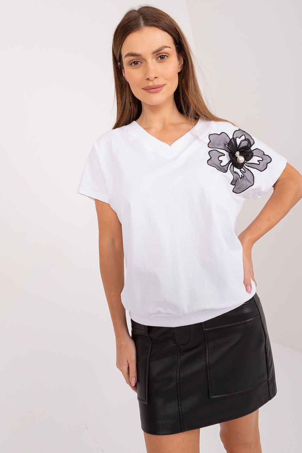 White cotton blouse with floral patch on short sleeve