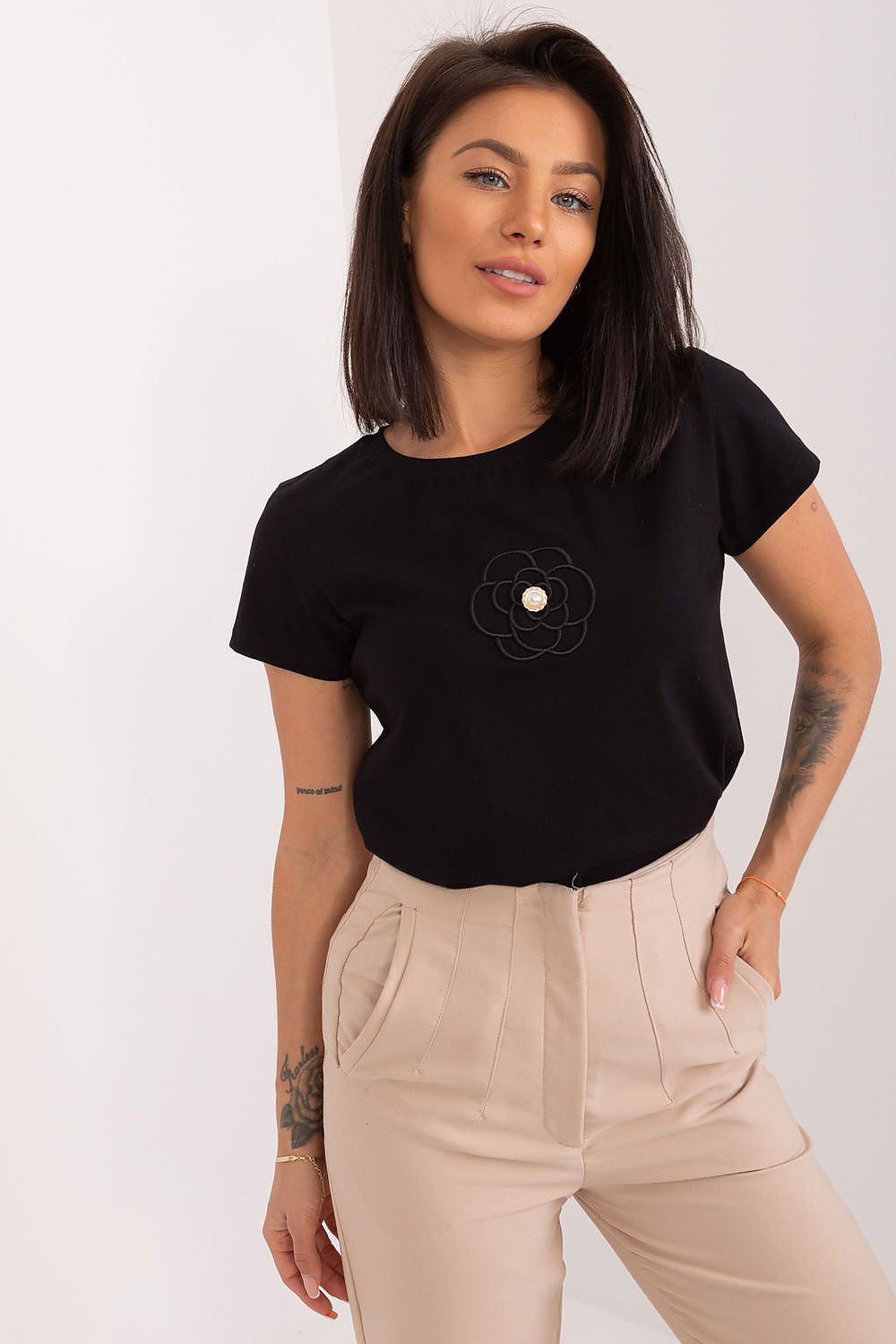 Black cotton blouse with embroidered flower detail, short sleeves