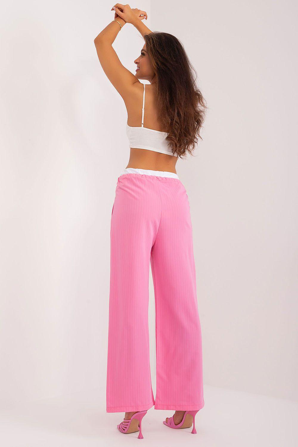Pink wide-leg women’s trousers viewed from back with drawstring waistband