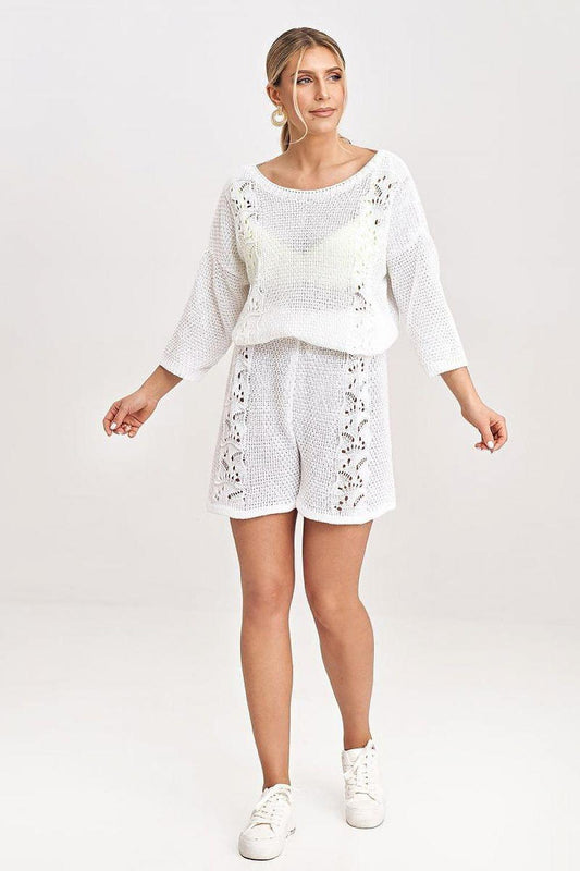 White knit sweater and shorts set, wide sleeves and lace-look cutouts