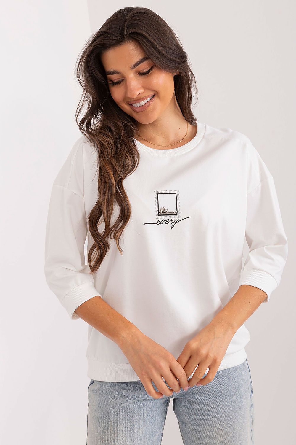 White blouse with round neck, 3/4 sleeves, small chest logo patch
