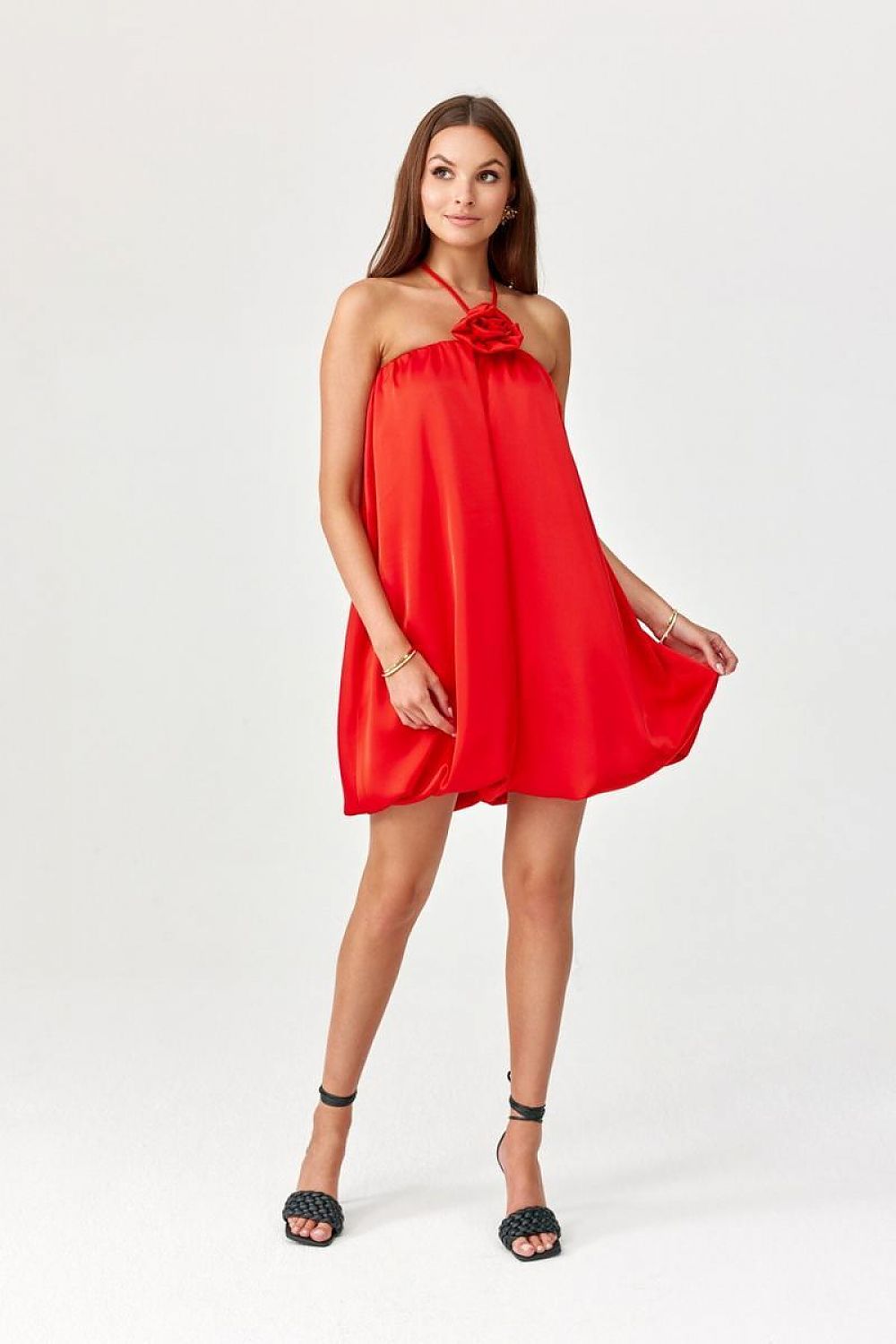 Red halter cocktail dress with gathered neckline and flowing short skirt.