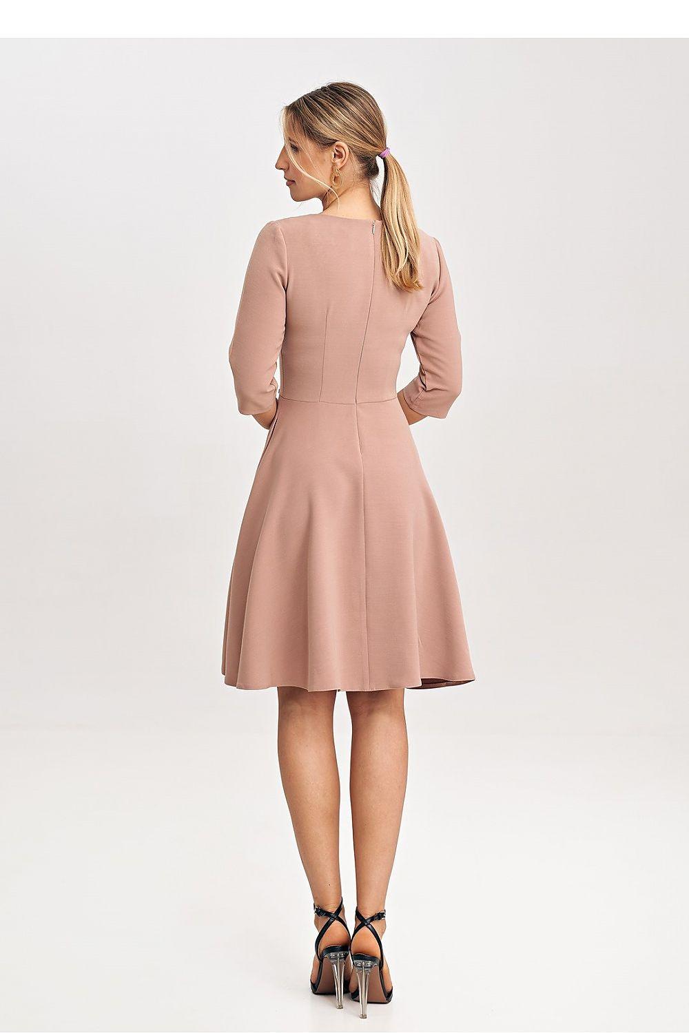 Pink daydress back view with three-quarter sleeves and flared hem
