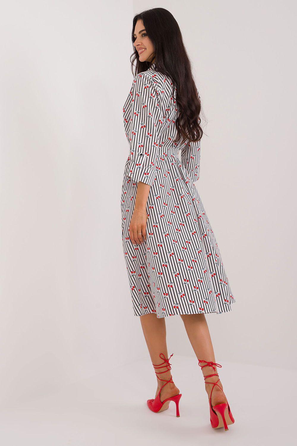 White daydress with red abstract print, button front, tie waist, midi length, 3/4 sleeves