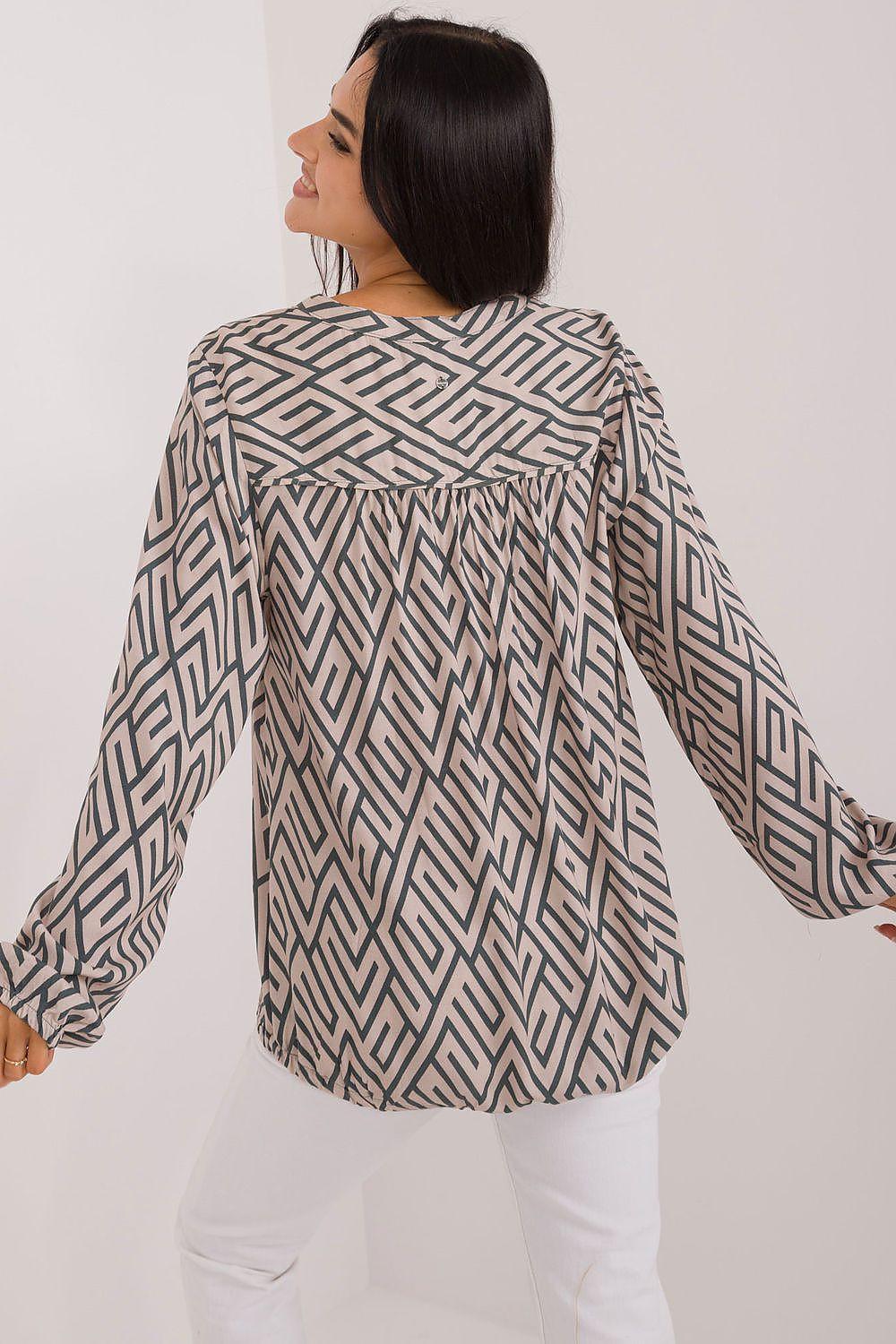 Back of beige geometric-pattern blouse with gathered yoke and long sleeves