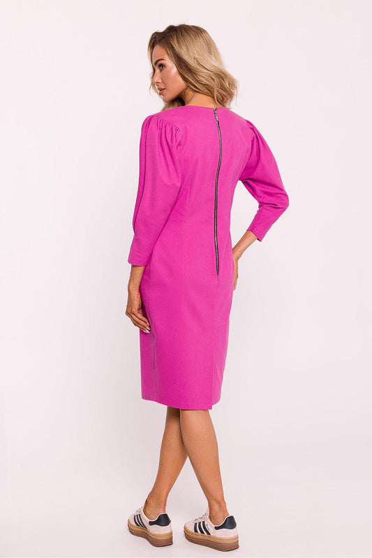 Pink midi day dress, back view, long sleeves and front slit.
