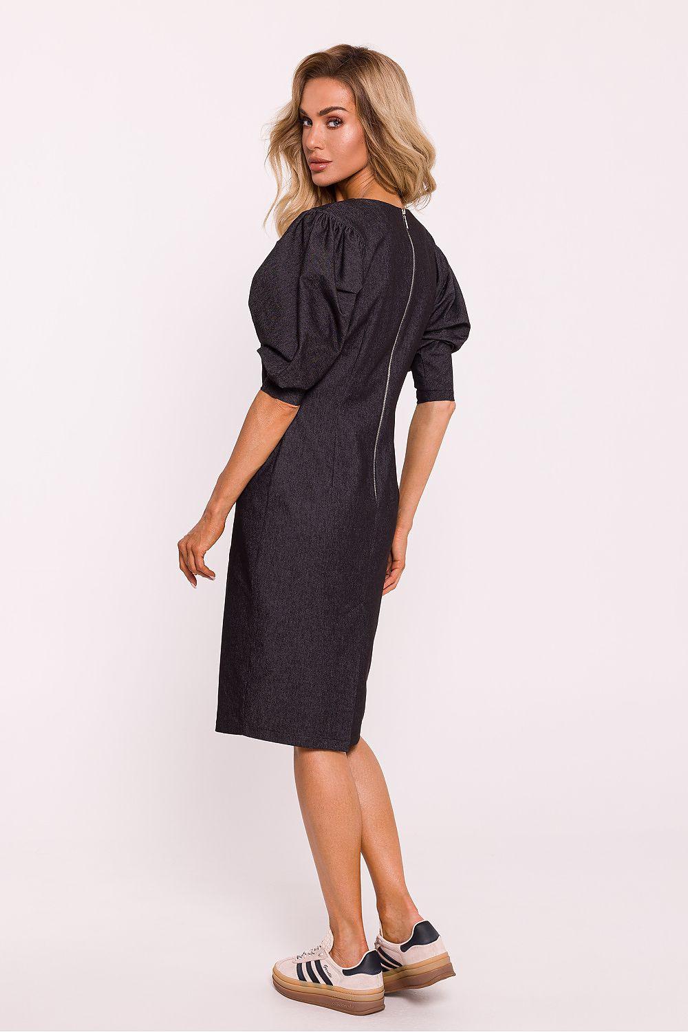 Black daydress back view with gathered sleeves, knee-length sheath and side slit