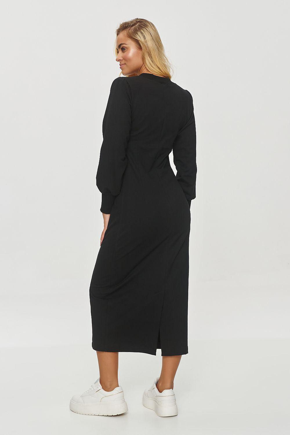 Black long-sleeve midi dress, back view, with front slit