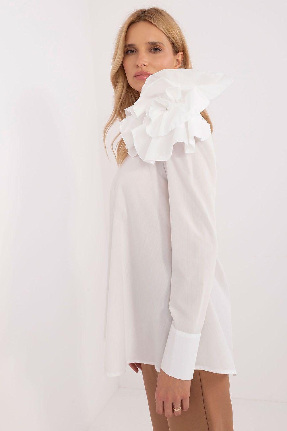 White off-shoulder blouse with long sleeves and layered shoulder ruffle detail.