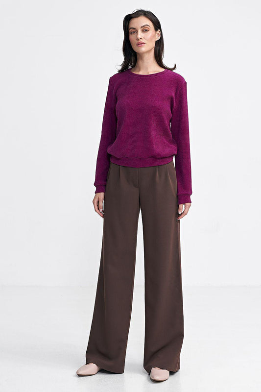 Brown wide-leg trousers with relaxed fit and crease front detail.