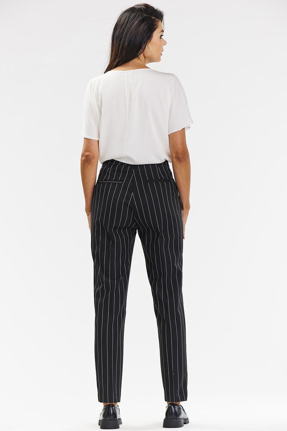 Women’s black pinstripe trousers, back view with belt loops and ankle length