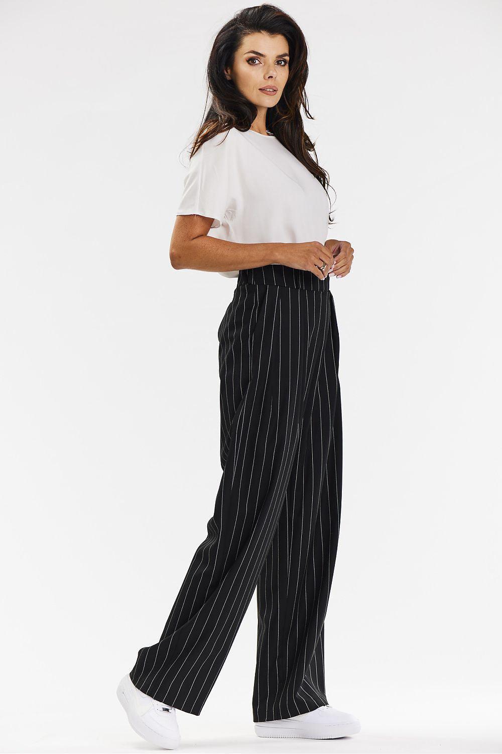 Black pinstripe wide-leg trousers with elastic waistband and loose drape