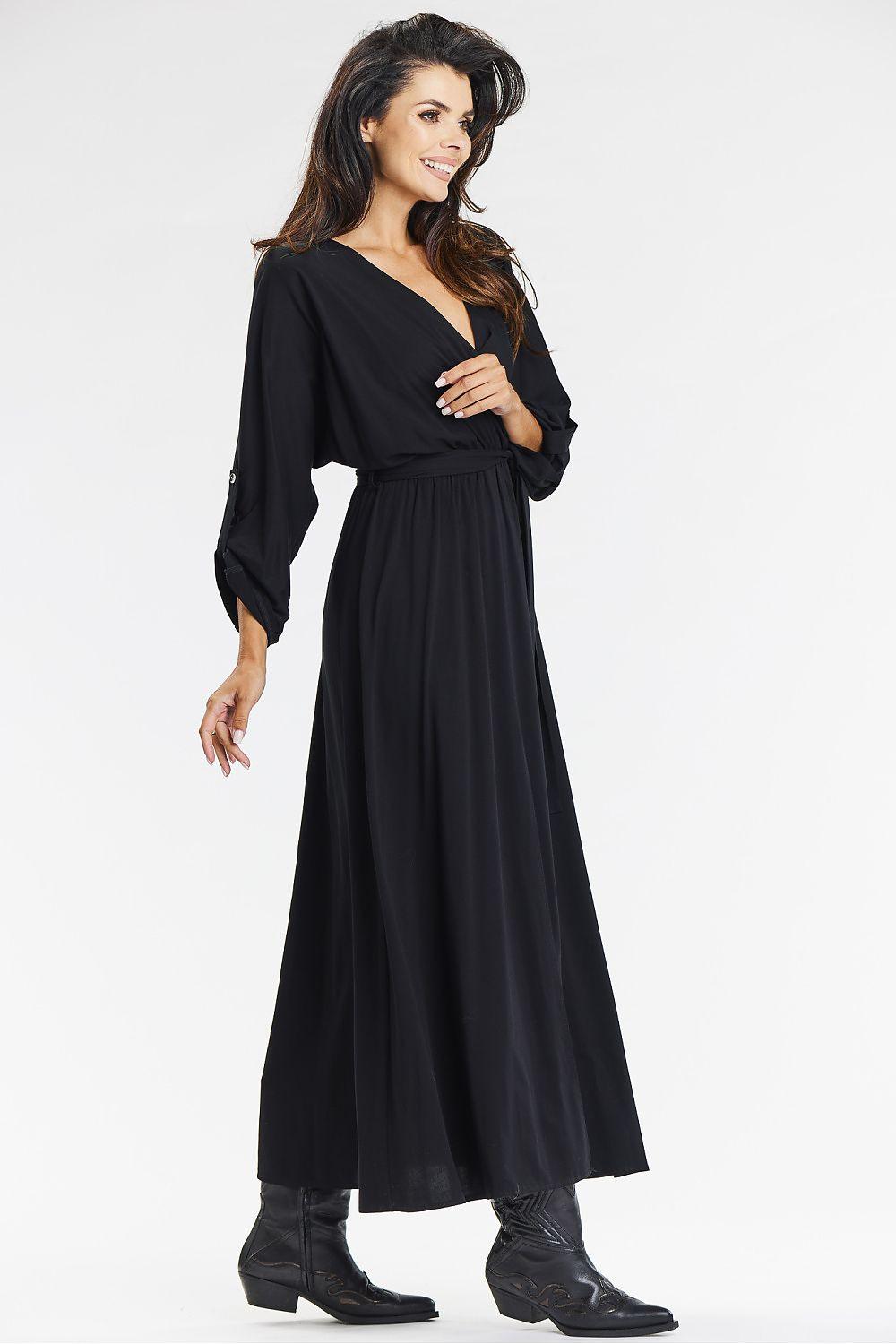 Black v-neck daydress with long sleeves and gathered waist tie, side slit