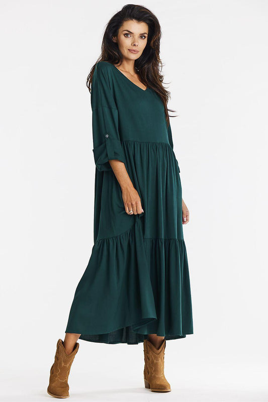 Green V-neck daydress with gathered waist and tiered hem, three-quarter sleeves