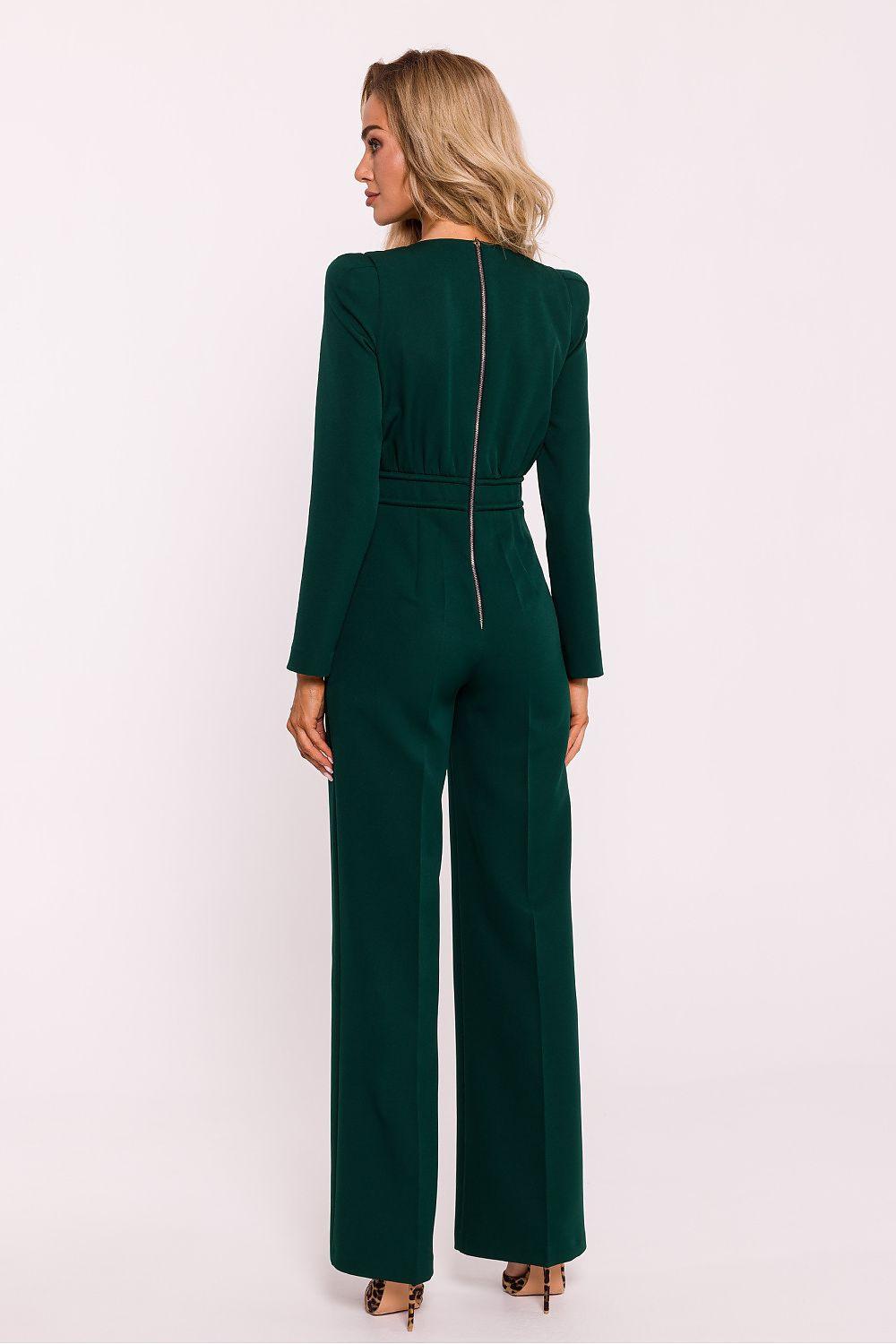 Dark green long-sleeve back view jumpsuit with central seam and hanging tie