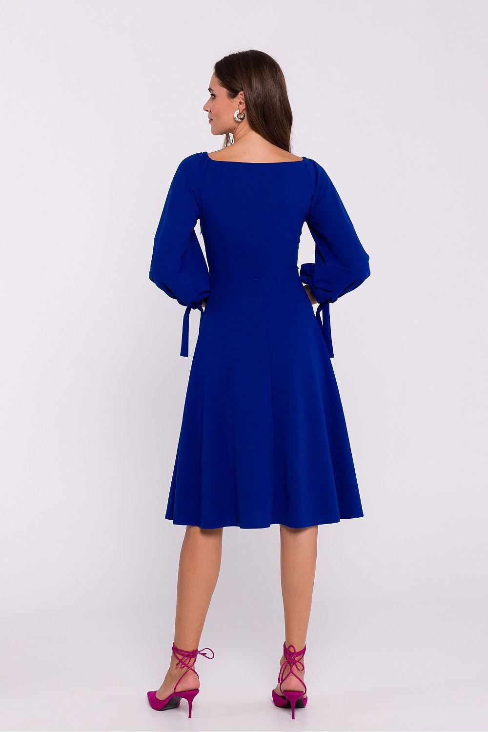 Royal blue A-line daydress with long puff sleeves and cuff tie bows