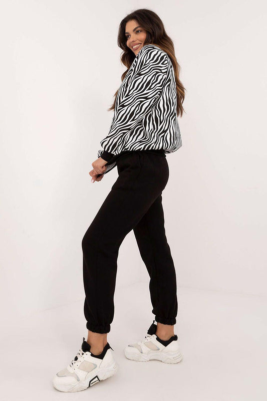Zebra-print hoodie with black jogger pants, tapered legs and elastic cuffs