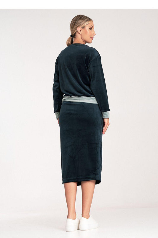 Two-piece set: long-sleeve top and midi pencil skirt with side slit, dark navy and contrast panel.