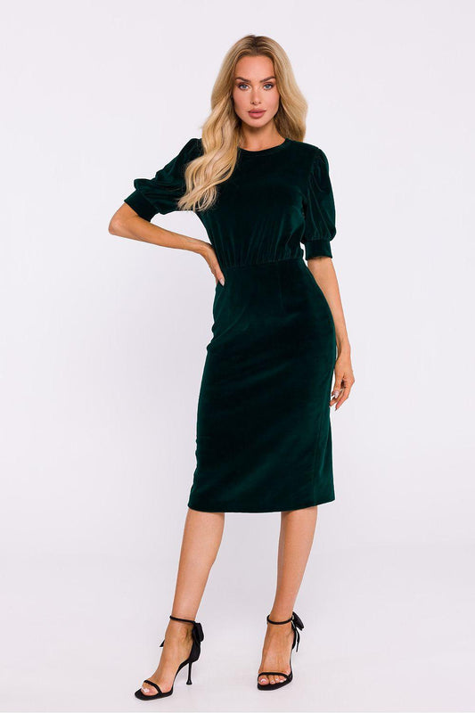 Green velvet day dress with gathered waist and short puff sleeves, midi length.