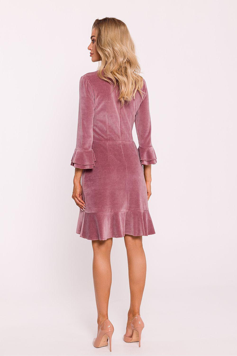 Pink daydress with long sleeves, ruffled cuffs, and flared tiered hem