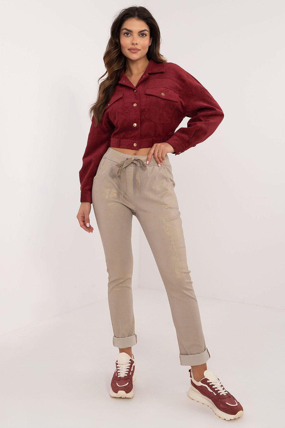 Beige tapered trousers with cuffed hem