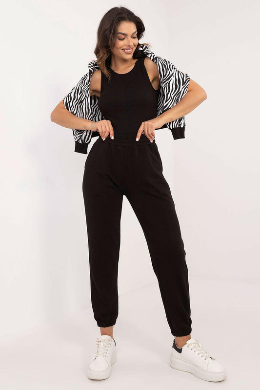 Zebra-print jacket over black top and black jogger pants set, drawstring waist